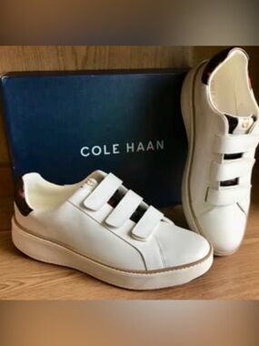 Cole Haan GrandPrø Topspin Triple Strap sneakers in ivory w/ tortoise accents.